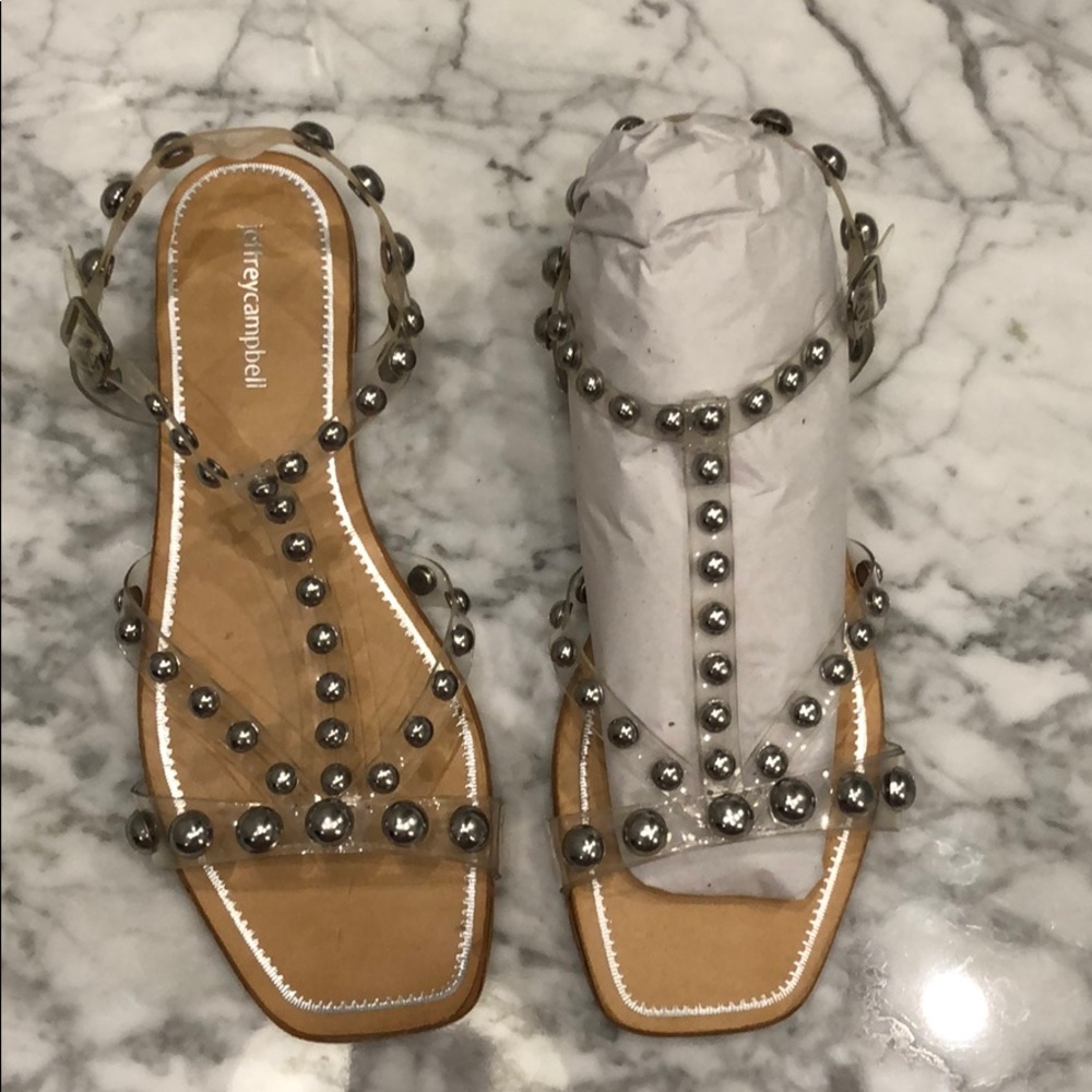 Jeffrey Campbell clear sandals with silver studs.